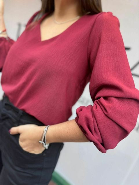 Blusa corinta manga larga con escote V