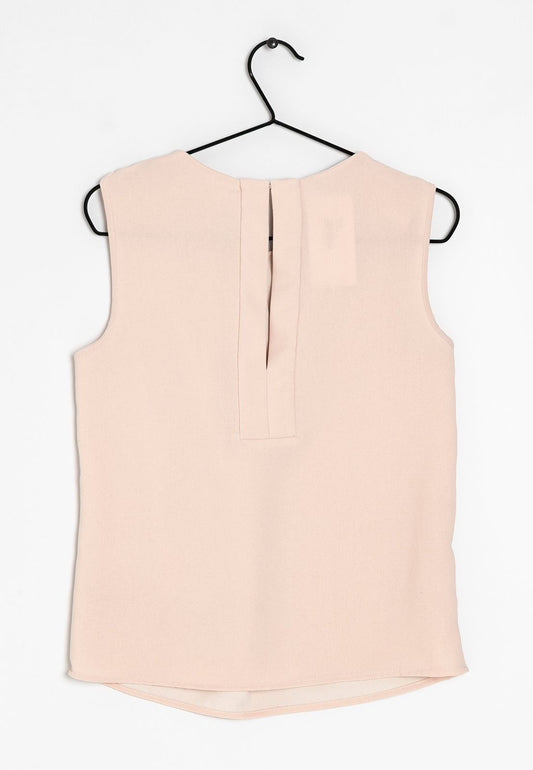 Blusa sin mangas nude Mango – elegancia sutil y versátil 🌸✨