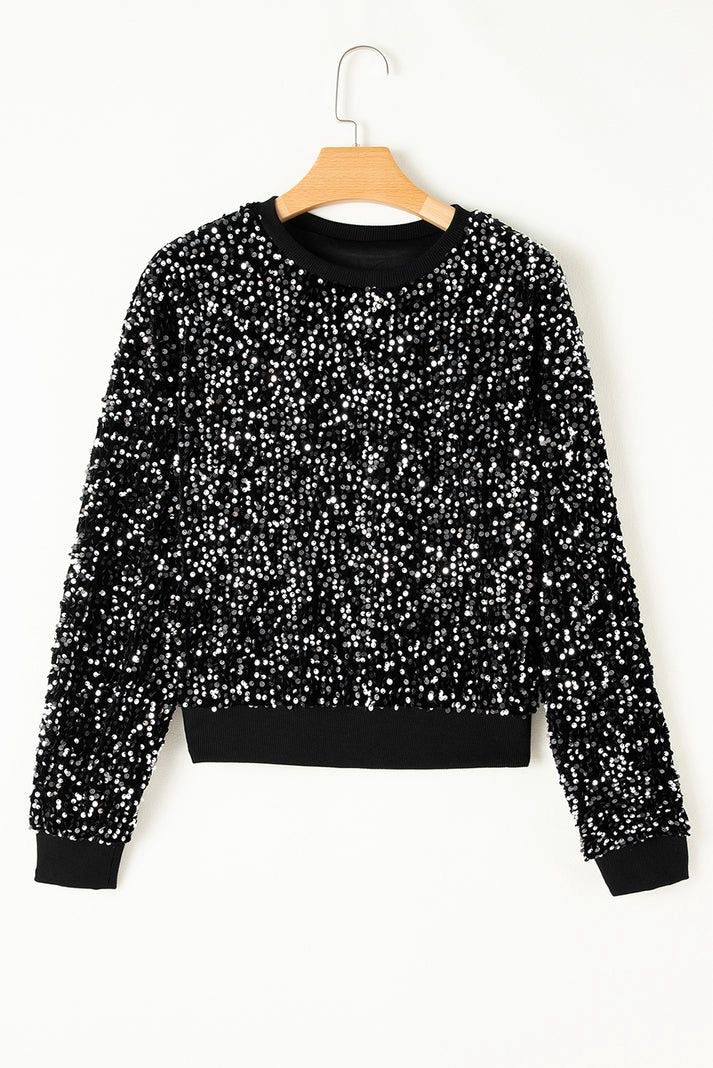 Sweater negro con lentejuelas – ¡Brilla con cada movimiento! ✨🖤