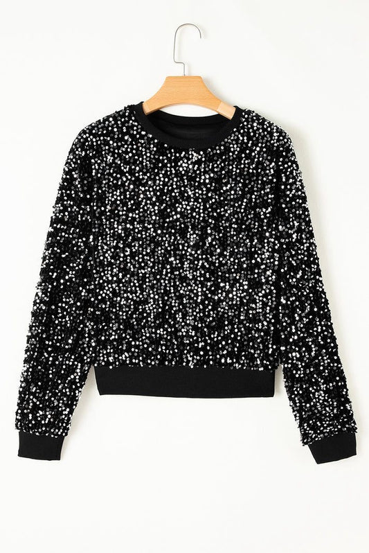 Sweater negro con lentejuelas – ¡Brilla con cada movimiento! ✨🖤
