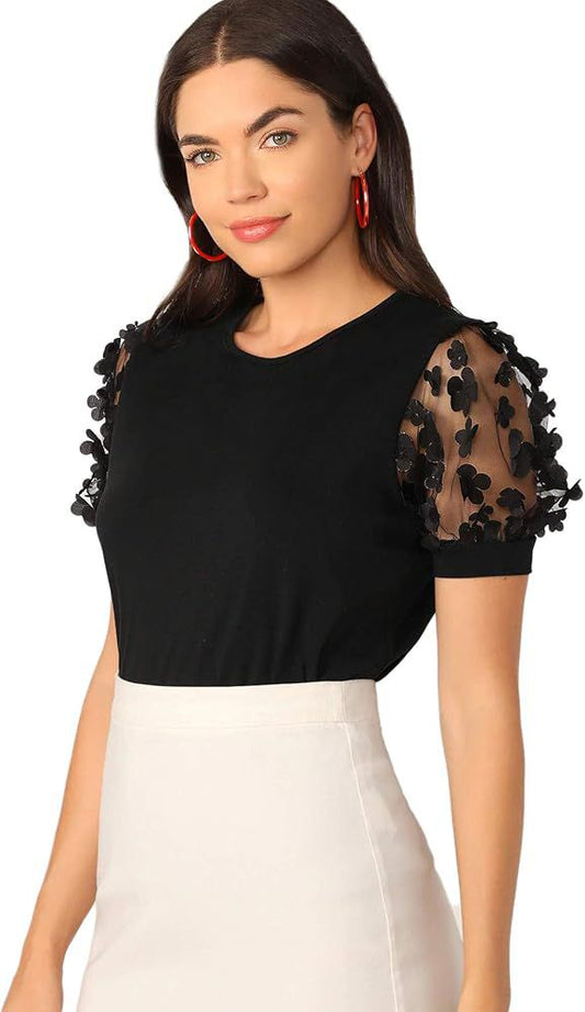 Blusa negra con mangas de tul bordadas – Toque elegante en cada detalle
